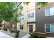 Inviting townhouse exterior featuring varied colors, desert landscaping, and a charming front door at 4650 Ranch House Rd # 86, North Las Vegas, NV 89031