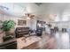 Open-concept living area featuring modern furniture, a ceiling fan, and an adjacent kitchen at 4650 Ranch House Rd # 86, North Las Vegas, NV 89031
