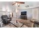 Bright living room with an open concept, modern ceiling fan, and comfortable leather seating at 4650 Ranch House Rd # 86, North Las Vegas, NV 89031