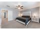 Spacious main bedroom featuring neutral paint, ceiling fan, and an ensuite bathroom at 4650 Ranch House Rd # 86, North Las Vegas, NV 89031
