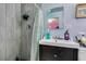 A bathroom featuring a walk in shower, updated sink and vanity at 513 Berry Cir, Las Vegas, NV 89107