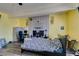 Bedroom featuring a brick fireplace, laminate flooring, neutral paint, and ceiling fan at 513 Berry Cir, Las Vegas, NV 89107