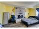 Bedroom featuring a brick fireplace, laminate flooring, and neutral paint at 513 Berry Cir, Las Vegas, NV 89107