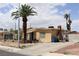 A quaint home with an expansive driveway and a distinctive brick chimney for added charm at 513 Berry Cir, Las Vegas, NV 89107