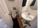 Powder room featuring a pedestal sink and a framed mirror at 5281 Starter Ave, Las Vegas, NV 89156