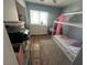 Bright bedroom featuring a modern bed frame and a white dresser under a window at 5281 Starter Ave, Las Vegas, NV 89156