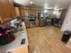 Open-concept kitchen with stainless steel appliances and view into dining area at 5281 Starter Ave, Las Vegas, NV 89156