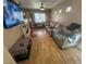 Comfortable living room with neutral colored furniture and large windows at 5281 Starter Ave, Las Vegas, NV 89156