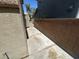 Narrow side yard space between house and cinder block wall at 5281 Starter Ave, Las Vegas, NV 89156