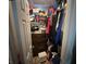 Organized walk-in closet filled with clothes, shoes, and storage boxes at 5281 Starter Ave, Las Vegas, NV 89156