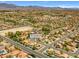 Expansive aerial shot of neighborhood with houses, streets, and mountain views in Las Vegas, Nevada at 5421 Tourmaline St, Las Vegas, NV 89130