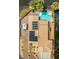 Drone eye view featuring a pool, solar panels, a camper, and backyard living spaces at 5421 Tourmaline St, Las Vegas, NV 89130