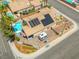 Beautiful aerial view showcasing a backyard pool, solar panels, and an RV parking area at 5421 Tourmaline St, Las Vegas, NV 89130