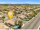 Neighborhood aerial view highlighting homes with pools and lush landscaping in a sunny location at 5421 Tourmaline St, Las Vegas, NV 89130