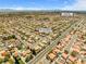 Panoramic aerial view of a residential neighborhood with homes, streets, and nearby school, in Las Vegas at 5421 Tourmaline St, Las Vegas, NV 89130