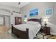 Cozy bedroom featuring a dark wood bed frame and a plush white comforter set at 5421 Tourmaline St, Las Vegas, NV 89130