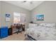 Well-lit bedroom with carpet flooring, a work desk, and a chest of drawers at 5421 Tourmaline St, Las Vegas, NV 89130