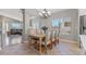 Dining room featuring a table with six chairs, hardwood floors, neutral paint, and view to the living room at 5421 Tourmaline St, Las Vegas, NV 89130