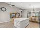 Spacious eat-in kitchen featuring a center island with white countertops, cabinet storage, and decorative lighting at 5421 Tourmaline St, Las Vegas, NV 89130