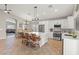 Bright kitchen featuring stainless steel appliances, a center island with seating, and an open floor plan at 5421 Tourmaline St, Las Vegas, NV 89130