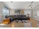 Spacious living room featuring hardwood floors, recessed lighting, and a comfortable sectional sofa at 5421 Tourmaline St, Las Vegas, NV 89130