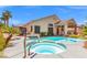 Backyard pool and spa with tanning deck and mature landscaping at 5421 Tourmaline St, Las Vegas, NV 89130