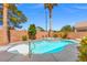 Backyard pool and spa with mature landscaping and brick perimeter at 5421 Tourmaline St, Las Vegas, NV 89130