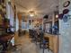 Entertainment bar area with ample seating, stone accents, and stocked shelves at 5445 Pendini Point Ct, Las Vegas, NV 89141