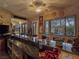 Entertainment bar with granite countertop and pool view at 5445 Pendini Point Ct, Las Vegas, NV 89141