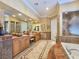 Spacious bathroom with double vanities, a soaking tub, and a walk-in shower at 5445 Pendini Point Ct, Las Vegas, NV 89141