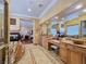 Luxurious bathroom with dual sinks, a jacuzzi tub, and a fireplace view at 5445 Pendini Point Ct, Las Vegas, NV 89141