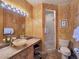Charming bathroom with a unique vessel sink, decorative walls, and a walk-in shower at 5445 Pendini Point Ct, Las Vegas, NV 89141