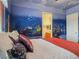 Unique bedroom featuring a mural with aquatic life and a comfortable bed at 5445 Pendini Point Ct, Las Vegas, NV 89141