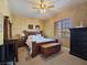 Charming bedroom with a decorative painted wall, warm colors, and natural light from the window at 5445 Pendini Point Ct, Las Vegas, NV 89141