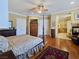 Large bedroom with fireplace, hardwood floors, and access to a bathroom at 5445 Pendini Point Ct, Las Vegas, NV 89141