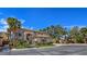 Elegant two-story home featuring a tiled roof, desert landscaping, and a secure gated entrance at 5445 Pendini Point Ct, Las Vegas, NV 89141