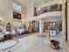 Grand foyer with high ceilings, marble floors, and an elegant staircase leading to the upper level at 5445 Pendini Point Ct, Las Vegas, NV 89141