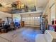 Spacious two-car garage with overhead storage racks, ample space for parking and organizing belongings at 5445 Pendini Point Ct, Las Vegas, NV 89141