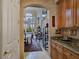 Hallway with granite countertop, built in cabinet, and dinning room view at 5445 Pendini Point Ct, Las Vegas, NV 89141