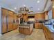 Bright kitchen featuring a central island, stainless steel appliances, and ample cabinetry at 5445 Pendini Point Ct, Las Vegas, NV 89141