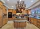 Large kitchen with granite counters, center island, and stainless appliances at 5445 Pendini Point Ct, Las Vegas, NV 89141