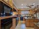 Large kitchen featuring granite countertops, custom wood cabinets, and an island at 5445 Pendini Point Ct, Las Vegas, NV 89141