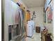 A modern laundry room with stainless steel appliances and ample counter space at 5445 Pendini Point Ct, Las Vegas, NV 89141