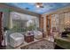Comfortable sitting area with natural light, vintage decor, and tile floors at 5445 Pendini Point Ct, Las Vegas, NV 89141