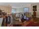 Relaxing loft area boasts comfortable armchairs, warm lighting, and hardwood flooring at 5445 Pendini Point Ct, Las Vegas, NV 89141