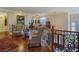 Spacious loft with beautiful railing overlooking the entry, perfect for a reading nook or lounge area at 5445 Pendini Point Ct, Las Vegas, NV 89141