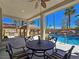Enjoy outdoor dining near the pool and tiki bar with a built-in barbecue at 5445 Pendini Point Ct, Las Vegas, NV 89141