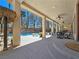 Covered patio with dining area and tiki bar provide shade near the pool with rock features at 5445 Pendini Point Ct, Las Vegas, NV 89141