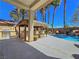 Outdoor oasis featuring a tiki bar with seating and a built-in barbecue at 5445 Pendini Point Ct, Las Vegas, NV 89141