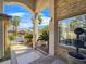 Stylish porch with stone columns, desert landscaping, and gated courtyard for a welcoming entrance at 5445 Pendini Point Ct, Las Vegas, NV 89141